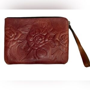 PATRICIA NASH small wristlet bag in a purplish pink tooled leather w/brown strap
